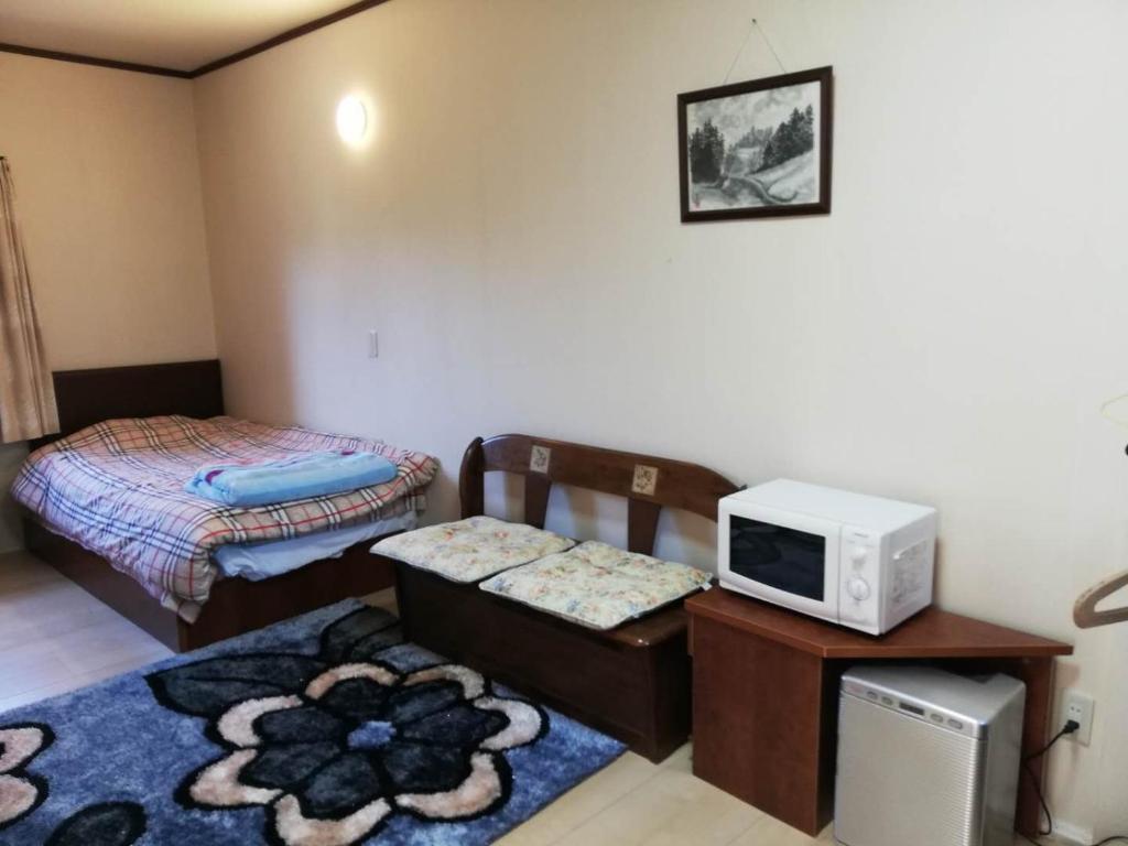 Postel nebo postele na pokoji v ubytování Hotel Otani