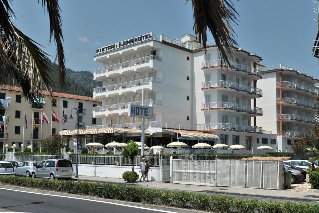 a person walking on a sidewalk in front of a hotel at Hotel Pietra di Luna in Maiori