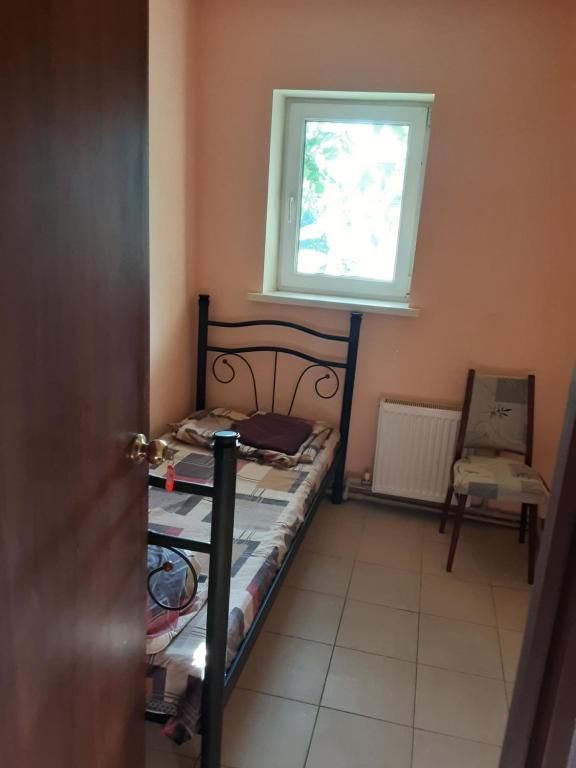 Ένα ή περισσότερα κρεβάτια σε δωμάτιο στο Одноместный номер