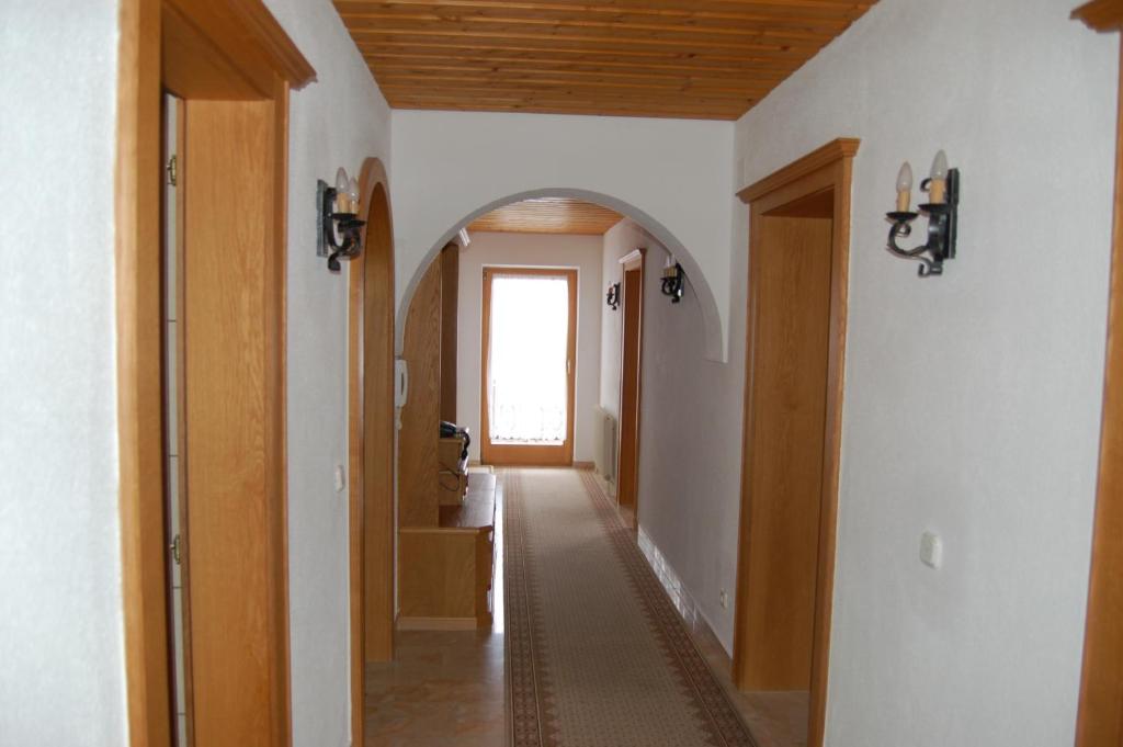 a hallway with an archway in a house at Haus Gantioler in Mieders