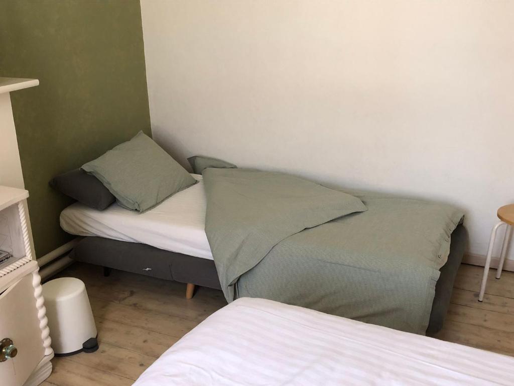 Postel nebo postele na pokoji v ubytování Beaux Temps b&b
