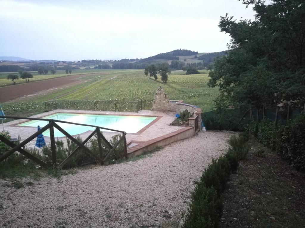 Kép Camera Matrimonialedoppia Con Balcone Vista Piscina szállásáról Monte Molinóban a galériában