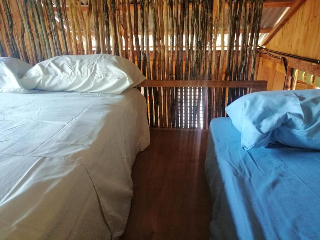 Ein Bett oder Betten in einem Zimmer der Unterkunft GuaiGüí Bayahibe