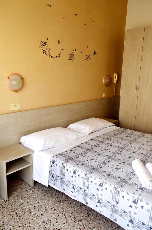 Postel nebo postele na pokoji v ubytování Hotel Cirene