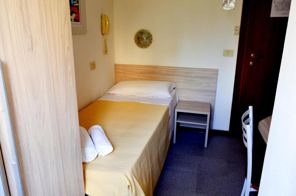 Postel nebo postele na pokoji v ubytování Hotel Cirene