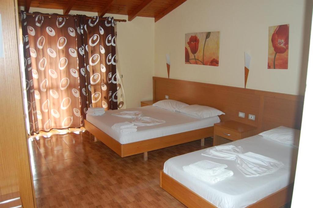 Postel nebo postele na pokoji v ubytování Hotel Ramosaco, Radhimë, Vlorë