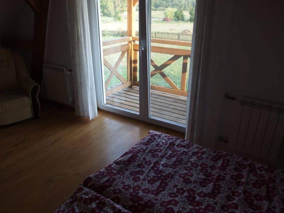 Postel nebo postele na pokoji v ubytování Siedlisko nad Rosiem