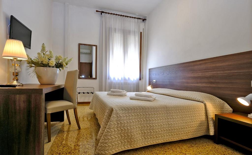 Posteľ alebo postele v izbe v ubytovaní Locanda Al Santuario