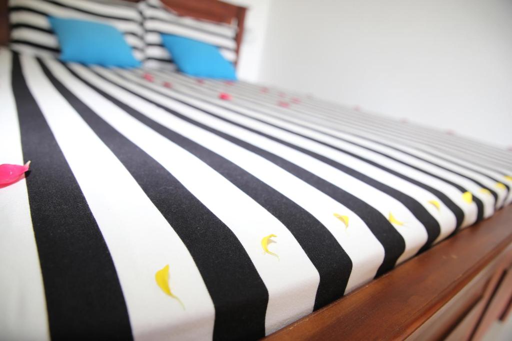 Postel nebo postele na pokoji v ubytování Ella Villa Nine Arch