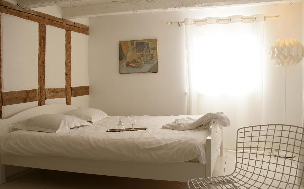 Postel nebo postele na pokoji v ubytování Un soir d'été - Chambres d'hôtes