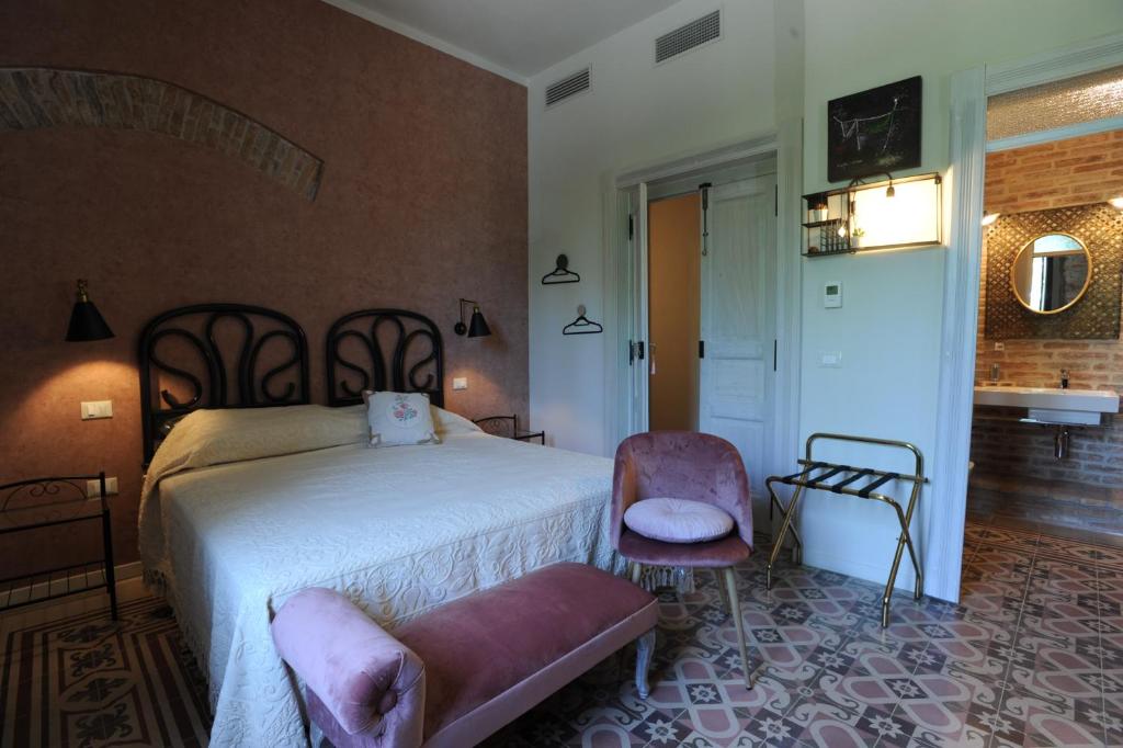 Postel nebo postele na pokoji v ubytování Palazzo Scura