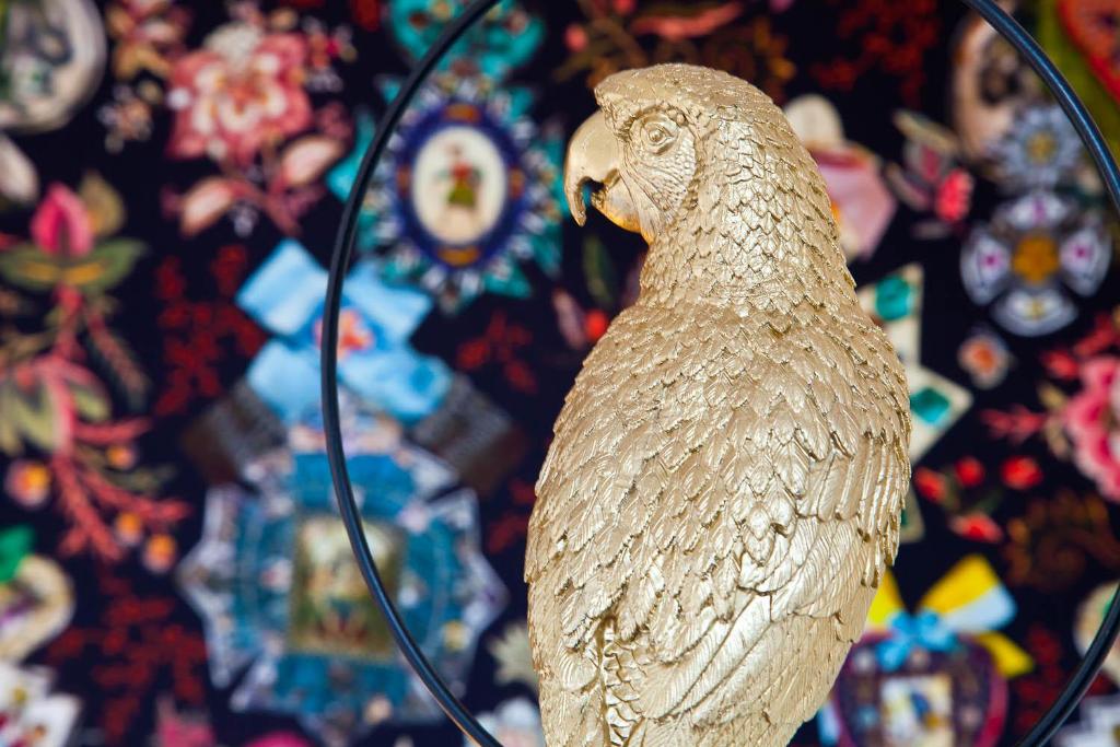 a statue of a white bird sitting on a table at Hôtel La Villa Port d'Antibes & Spa in Antibes