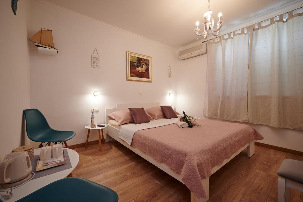 Postel nebo postele na pokoji v ubytování Rooms Antonio