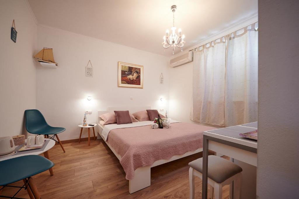 Postel nebo postele na pokoji v ubytování Rooms Antonio