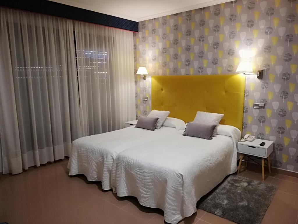 Postel nebo postele na pokoji v ubytování Hotel Las Moradas
