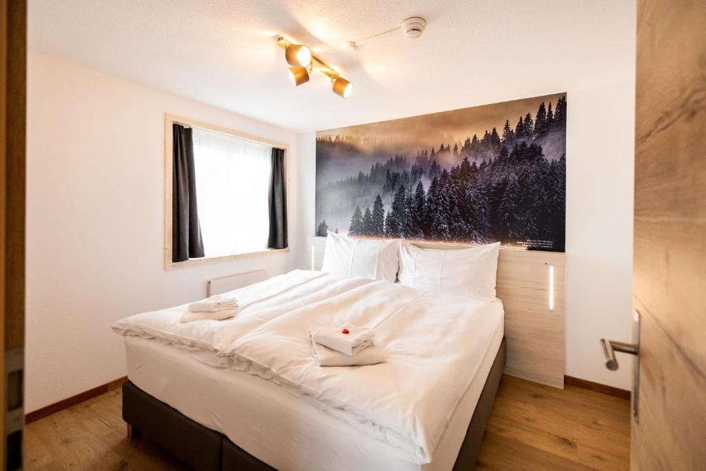 Postel nebo postele na pokoji v ubytování Roggenstock Lodge