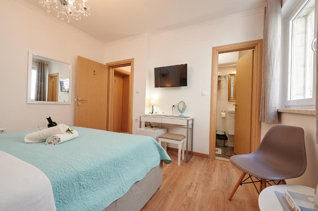 Postel nebo postele na pokoji v ubytování Rooms Antonio