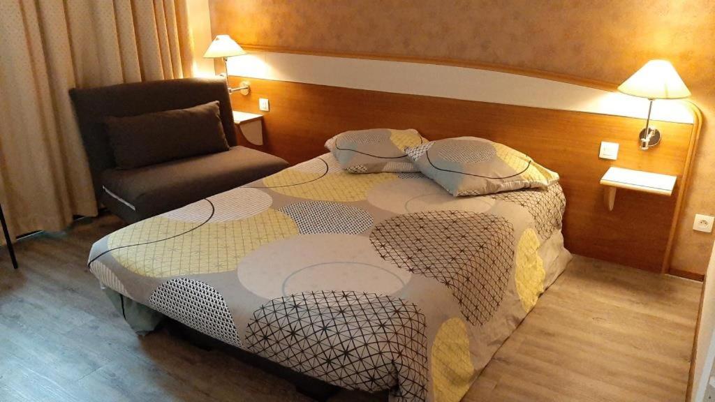 En eller flere senge i et værelse på Résidence Aquatis