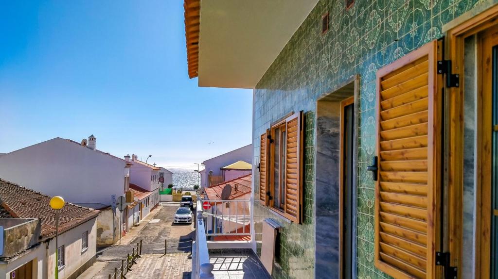 a view of a street in a town with buildings at Roots Apartment in Zambujeira do Mar