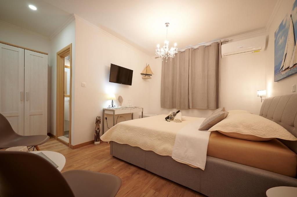 Postel nebo postele na pokoji v ubytování Rooms Antonio