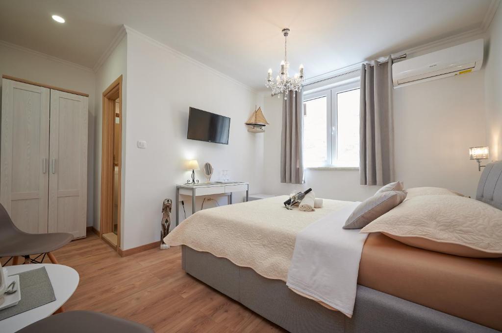 Postel nebo postele na pokoji v ubytování Rooms Antonio