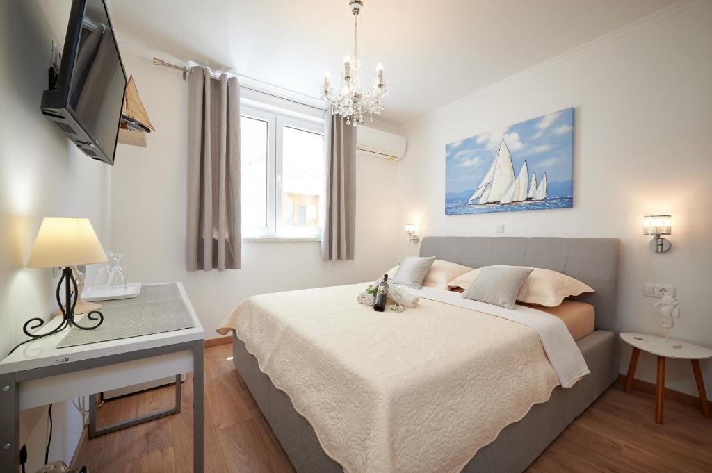 Postel nebo postele na pokoji v ubytování Rooms Antonio