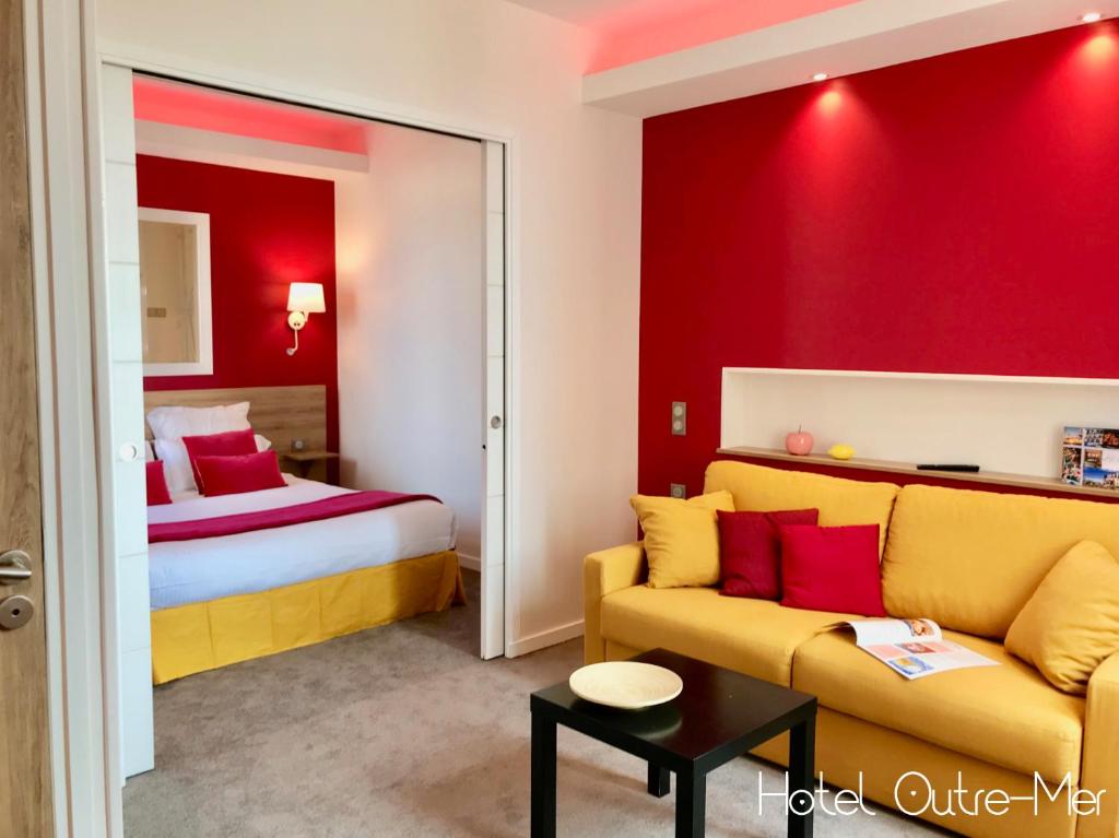 Postel nebo postele na pokoji v ubytování Hôtel Outre-Mer - Villa Le Couchant