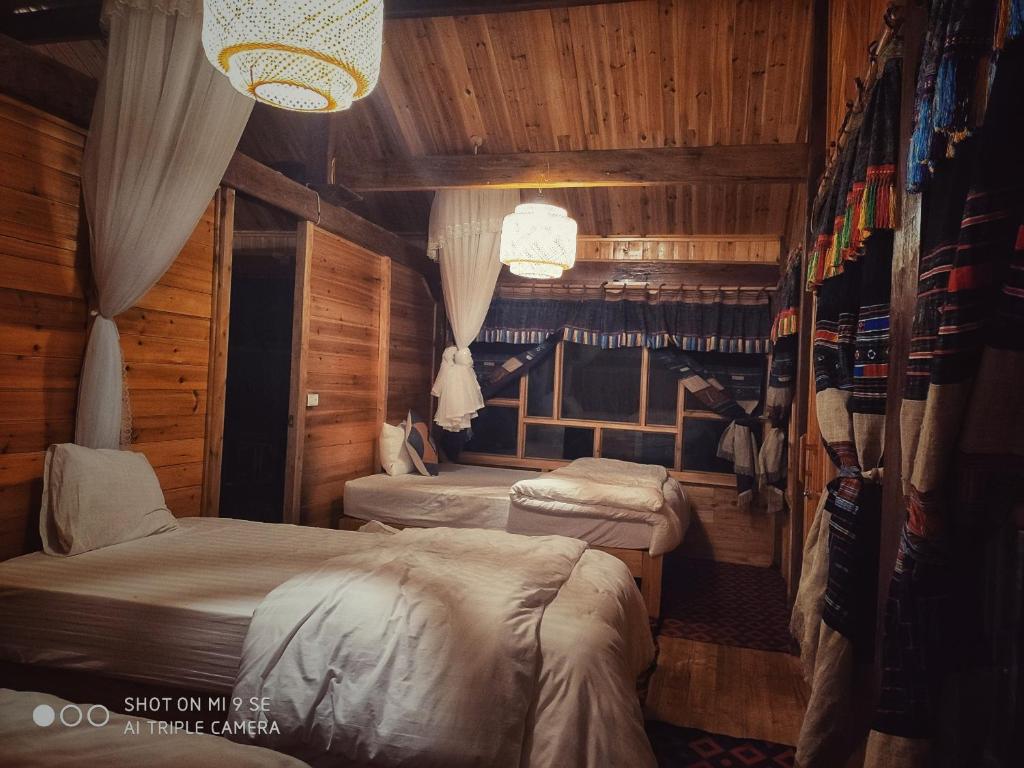 Postel nebo postele na pokoji v ubytování Chô Family