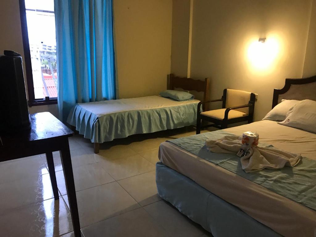 Postel nebo postele na pokoji v ubytování Hotel Viru Viru II