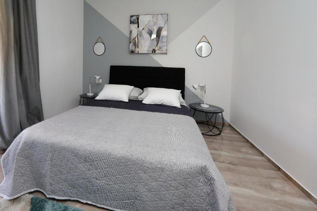 Postel nebo postele na pokoji v ubytování Apartmani Marta