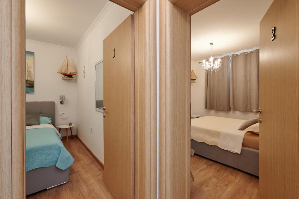 Postel nebo postele na pokoji v ubytování Rooms Antonio