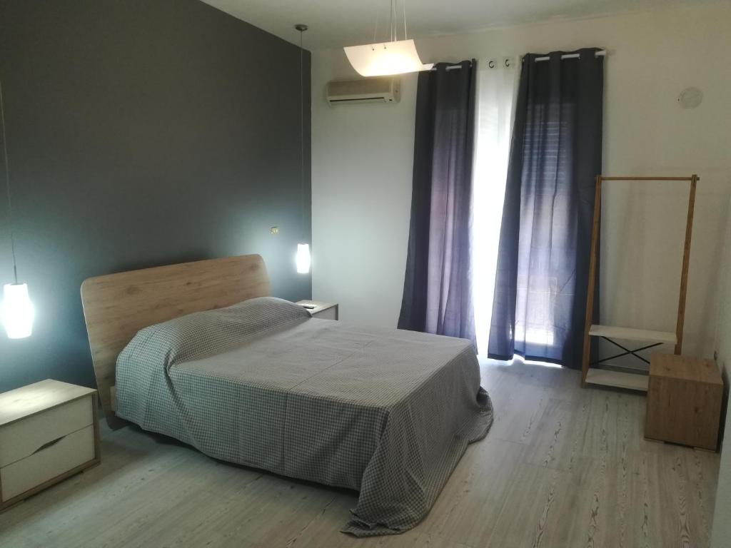 Säng eller sängar i ett rum på Home Mazzei Piazza Bilotti