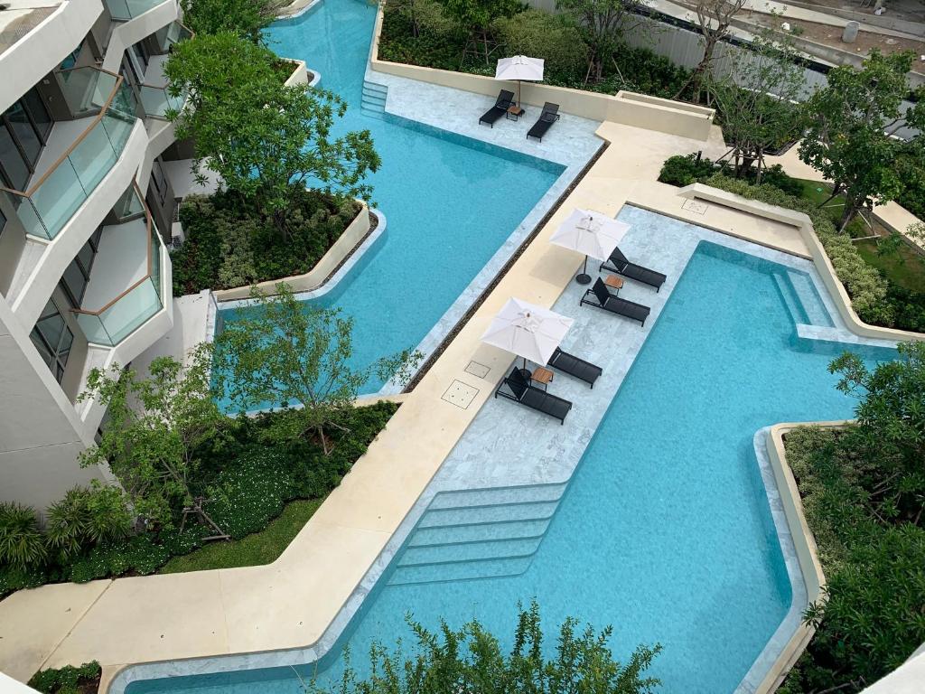 an overhead view of a swimming pool in a building at Santorini Khao Takiab Huahin Beach Front in Hua Hin