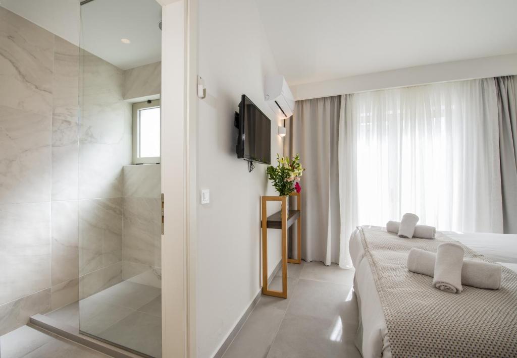 Posteľ alebo postele v izbe v ubytovaní Lotus Hotel Apartments