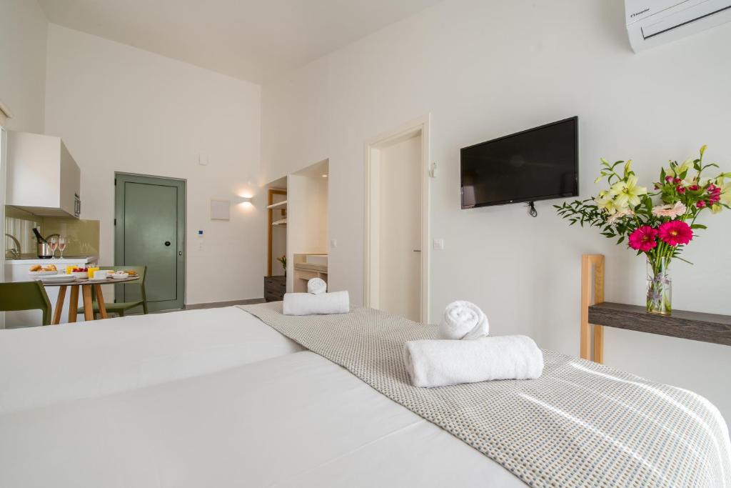 Posteľ alebo postele v izbe v ubytovaní Lotus Hotel Apartments