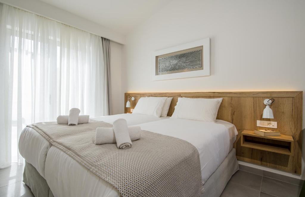 Posteľ alebo postele v izbe v ubytovaní Lotus Hotel Apartments