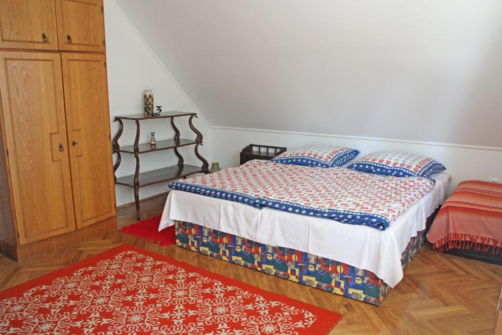 Posteľ alebo postele v izbe v ubytovaní Illés Apartman