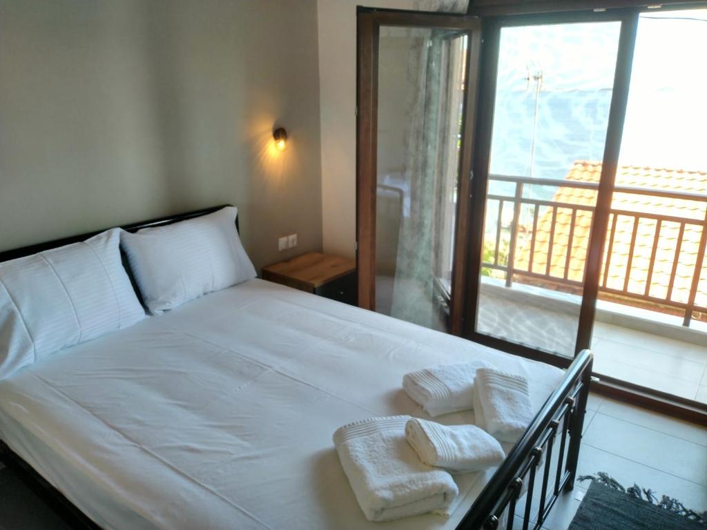 Ένα ή περισσότερα κρεβάτια σε δωμάτιο στο Gianni's Apartment By The Sea