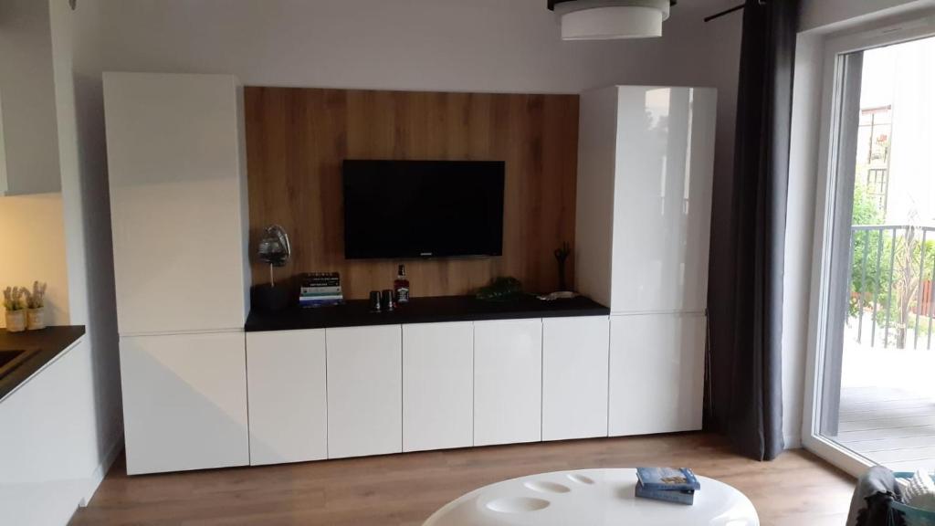 TV a/nebo společenská místnost v ubytování Daniel’s Apartament