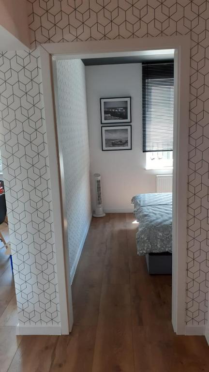 Postel nebo postele na pokoji v ubytování Daniel’s Apartament