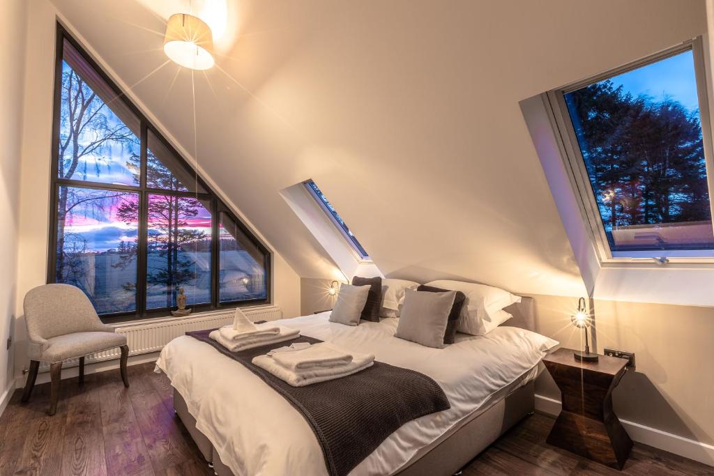 Postel nebo postele na pokoji v ubytování Newlands Lodges