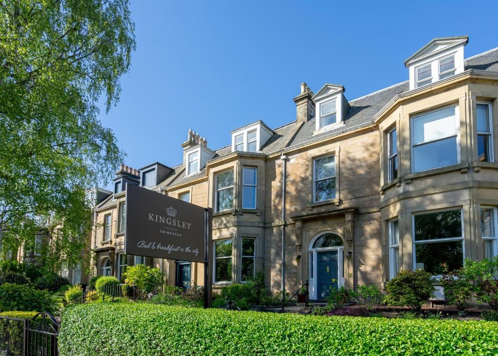 a house with a sign in front of it at Kingsley Guest House in Edinburgh
