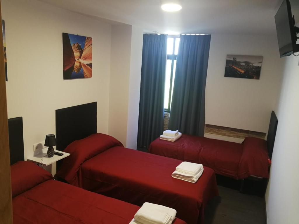 Postel nebo postele na pokoji v ubytování Pensión Tasaga