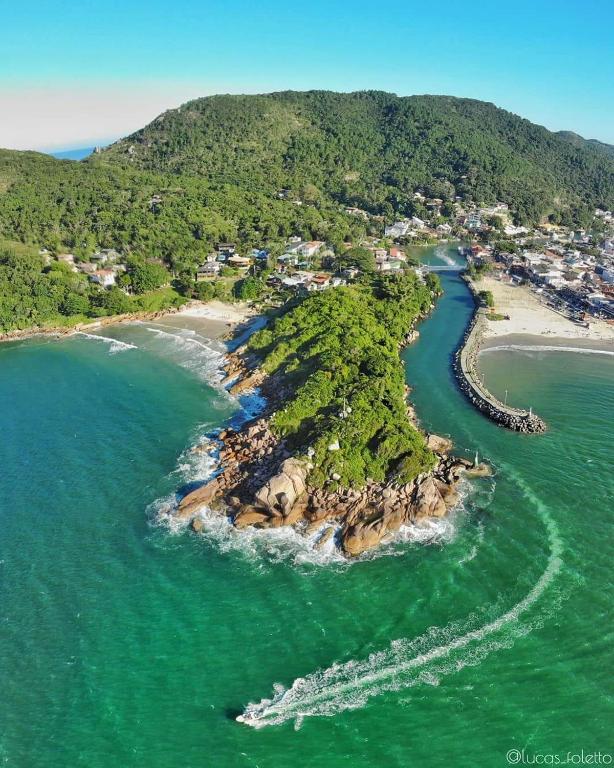 an aerial view of an island in the ocean at FLORIPA FLORINDO APART in Florianópolis