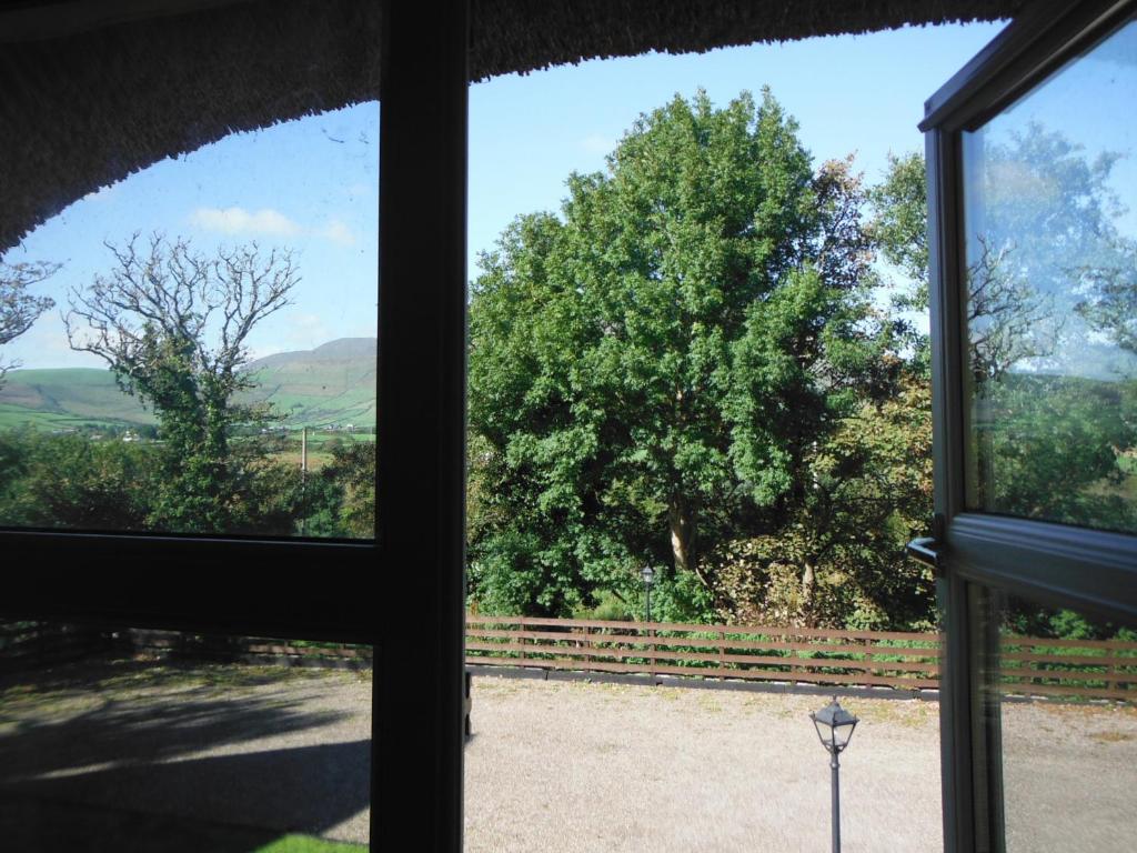 a view from the window of a house at Inspiration Lodge in Anascaul