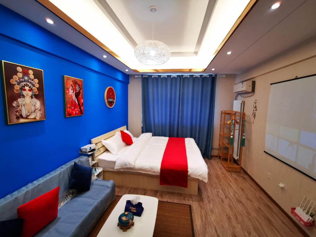 Postel nebo postele na pokoji v ubytování Yu Jing Xuan Boutique Apartment