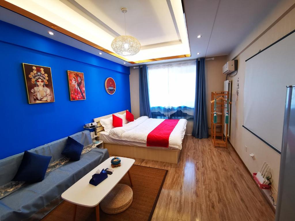 Postel nebo postele na pokoji v ubytování Yu Jing Xuan Boutique Apartment
