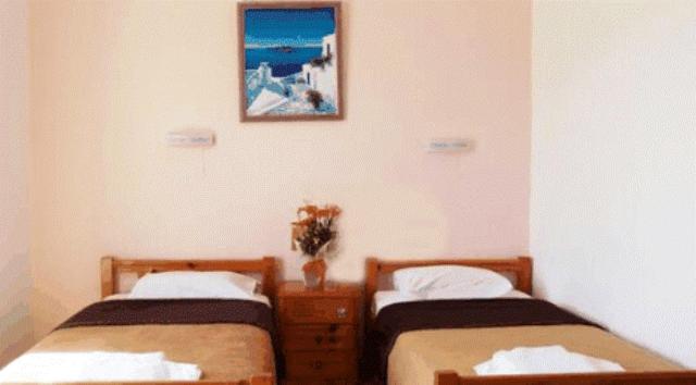 Postel nebo postele na pokoji v ubytování Babis Hotel