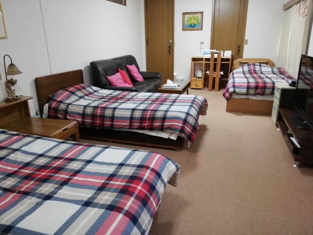 Postel nebo postele na pokoji v ubytování Hotel Otani