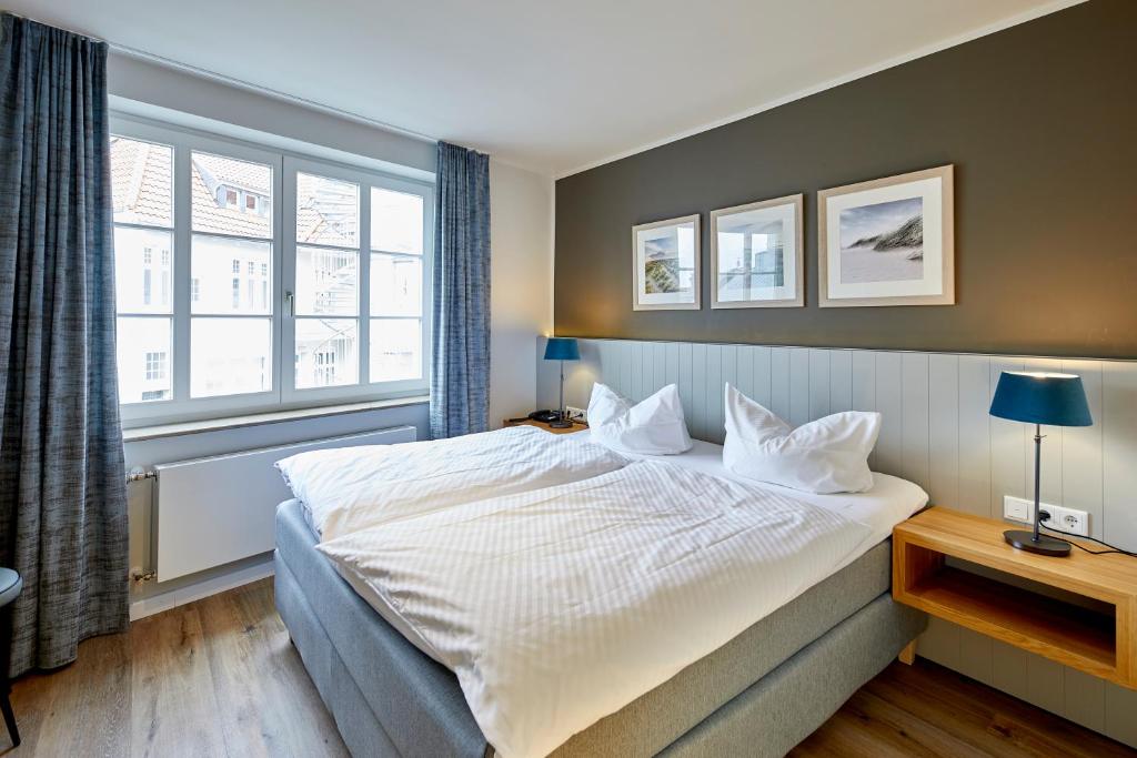 Postel nebo postele na pokoji v ubytování Hotel Friesenhof